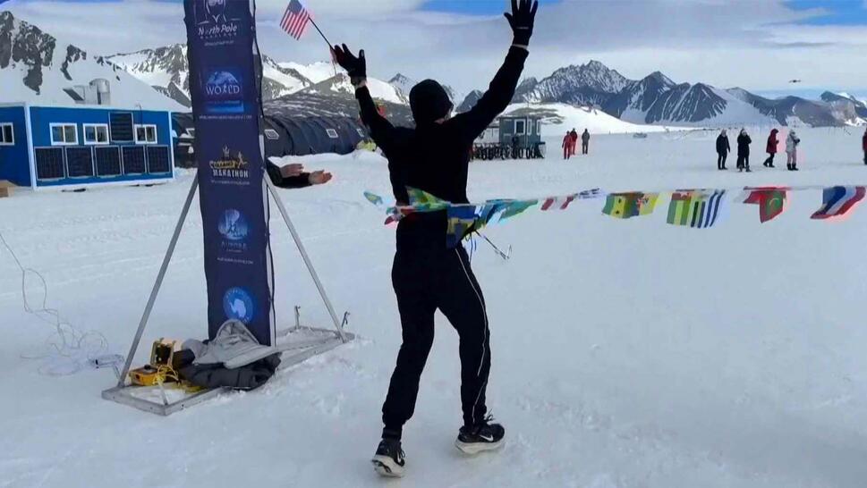 Runner crosses finish line backwards