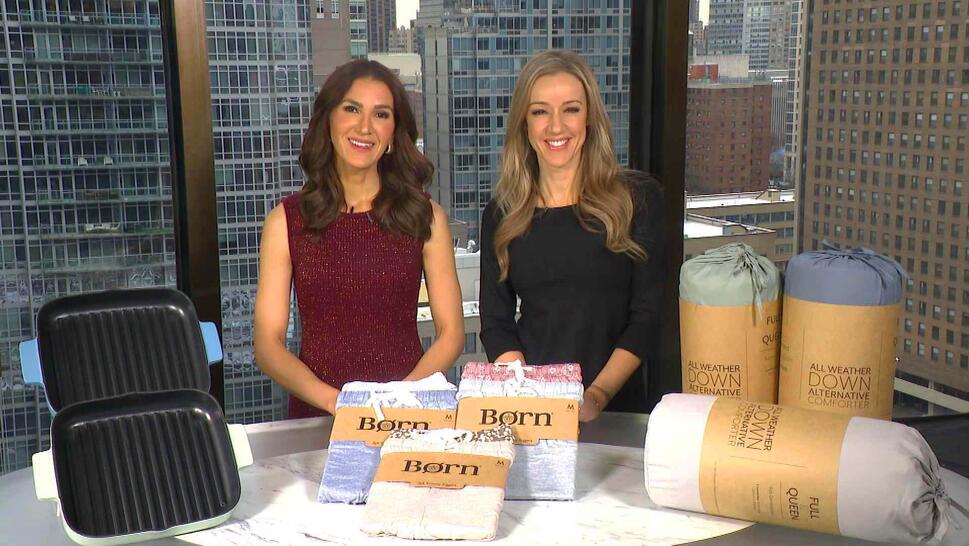 Two women standing in front of a table displaying a Cast Iron, Joggers, Comforter