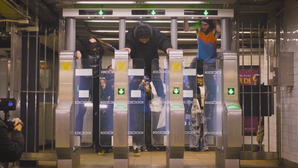 Three people jumping subway turnstiles in New York City