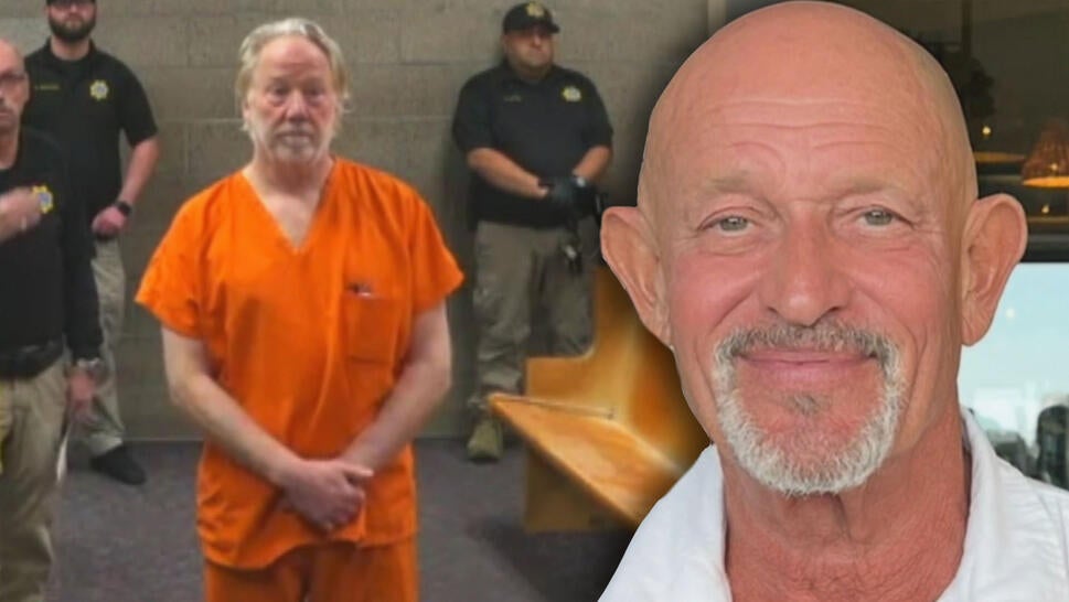 Timothy Busfield standing in an orange jumpsuit in a courtroom / Colin Swift