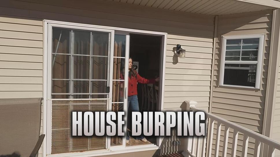 Woman opening the door to her house, the phrase "House Burping" is at bottom