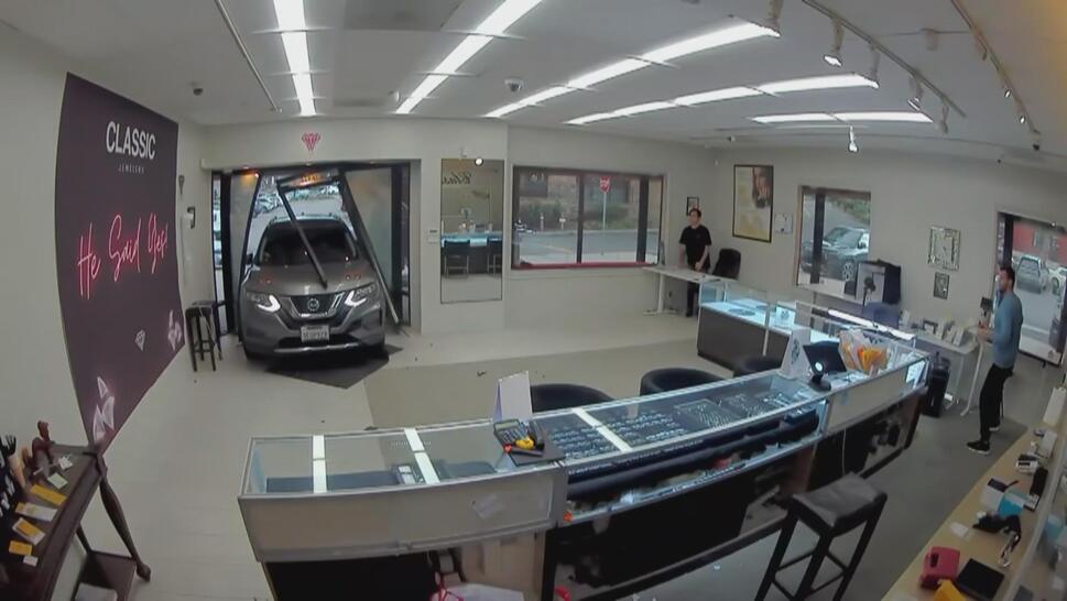 Security footage of an SUV crashing through the front of a jewelry store