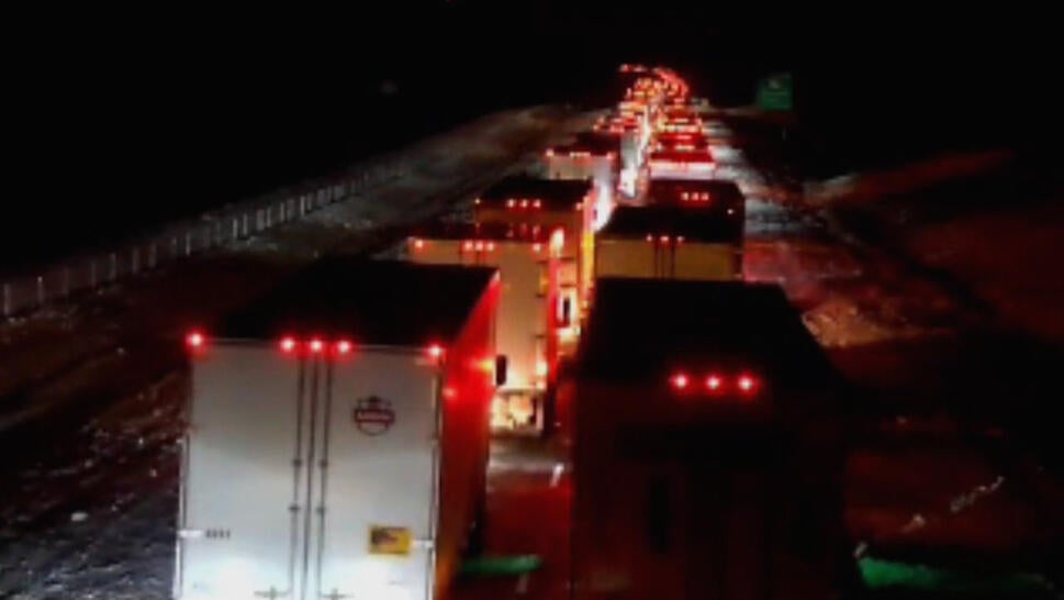 Cars and trucks stopped at night on a highway