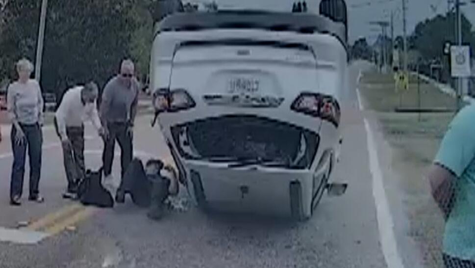 Officer Rescues Sisters Trapped In Overturned SUV