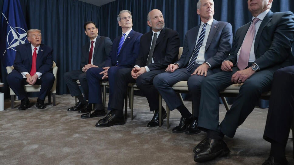 Donald Trump and advisors, all wearing the same shoe