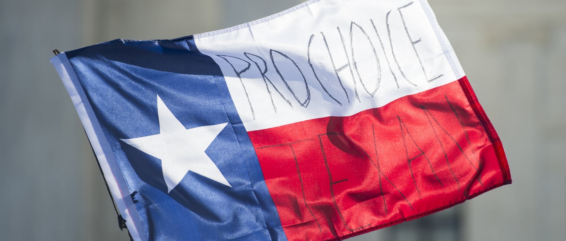 Pro-choice written on Texas flag