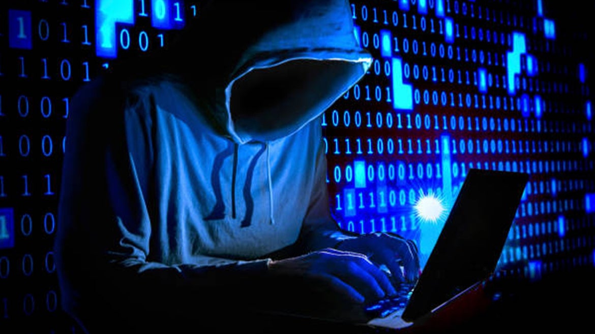 Stock image of a cybercriminal