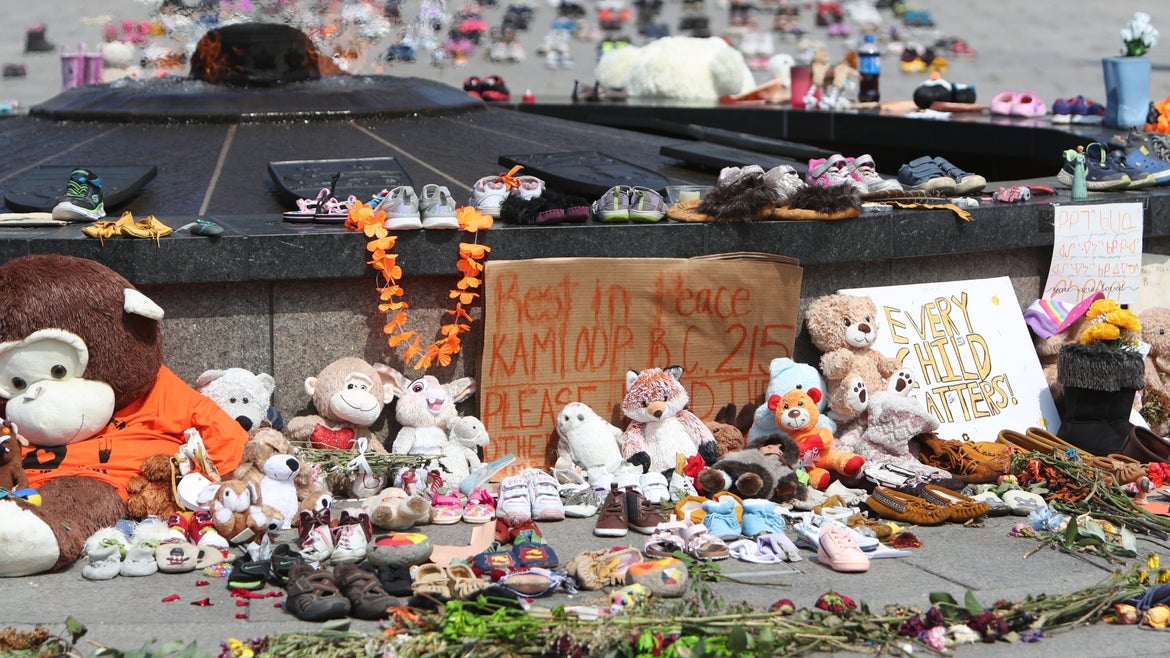 A powerful display of stuffed bears and shoes on Parliament Hill in Ottawa, Canada.