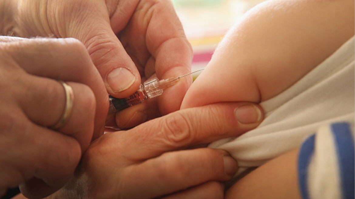 A stock image of an infant getting a vaccination.