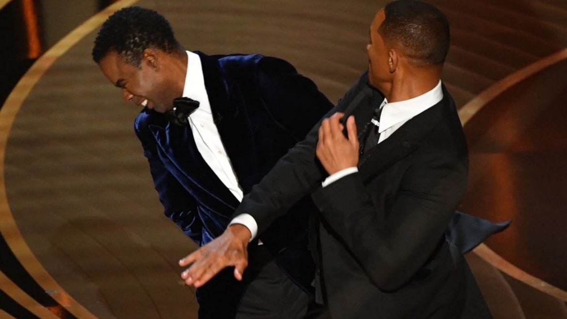 US actor Will Smith (R) slaps US actor Chris Rock onstage during the 94th Oscars at the Dolby Theatre in Hollywood, California on March 27, 2022.