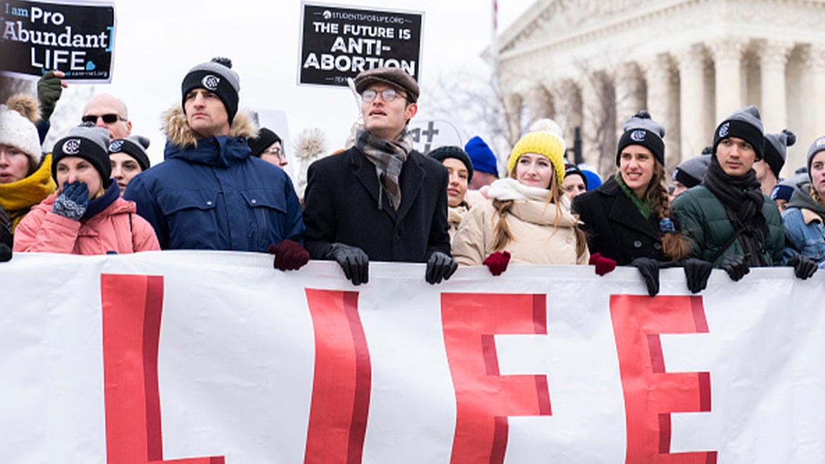 Demonstrators walk on First Street during the annual 49th March for Life anti-abortion demonstration on Capitol Hill in Friday, January 21, 2022. 