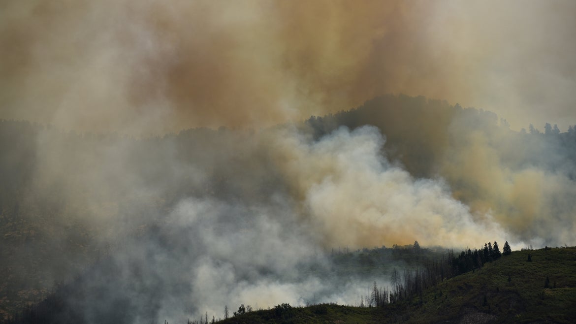 Smoke and wildfire on mountain