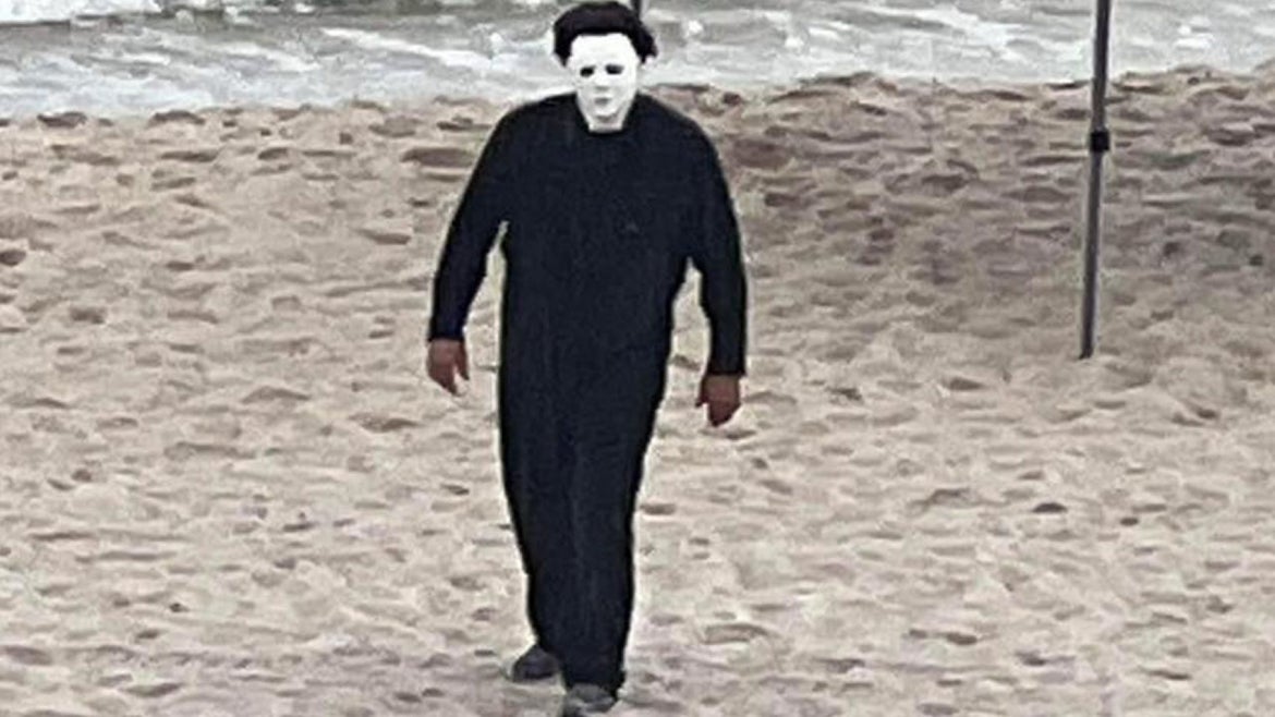 Todd Easter and several friends were staying near the water while on vacation from Birmingham, Alabama, when Easter stepped out onto the patio and spotted the man dressed as Michael Myers in the sand.