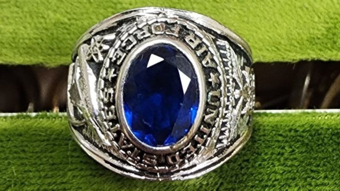 class ring with blue stone